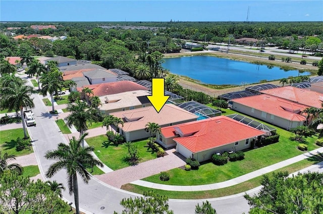 birds eye view of property with a water view