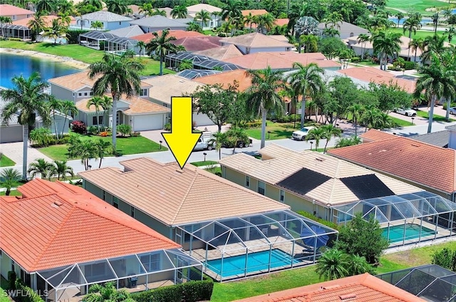 aerial view featuring a water view and a residential view