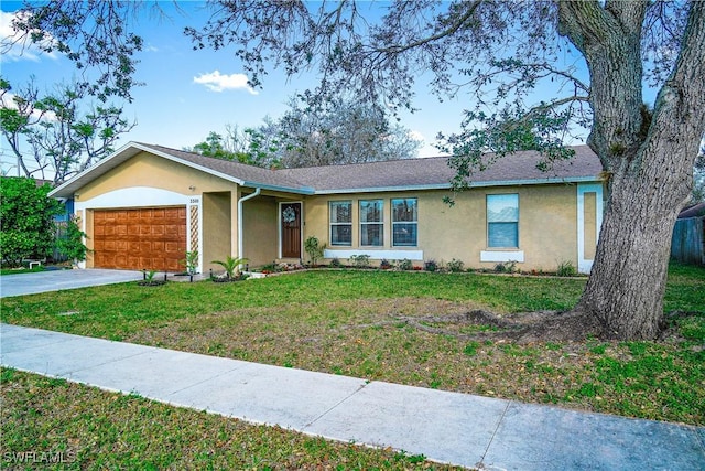 ranch-style home with a front yard, driveway, an attached garage, and stucco siding