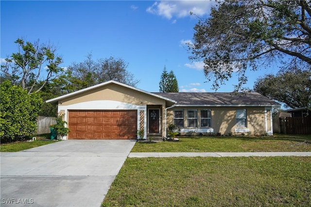 single story home featuring a garage and a front yard