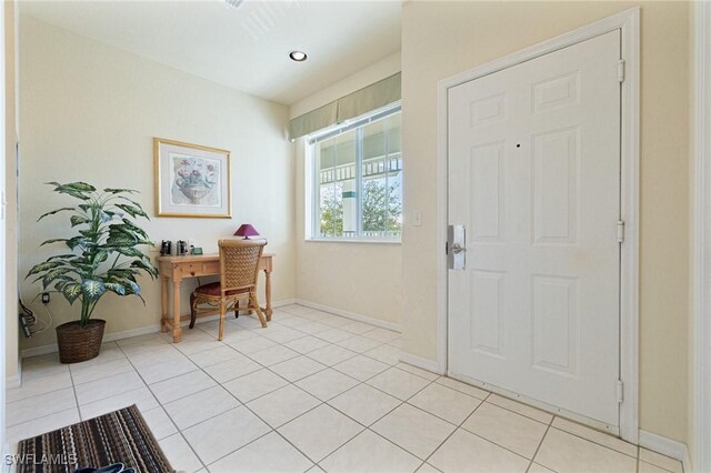 entryway with light tile patterned floors