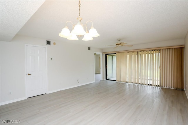 unfurnished room featuring ceiling fan with notable chandelier, a textured ceiling, and light hardwood / wood-style floors