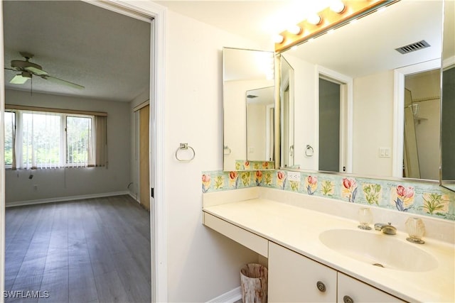 bathroom featuring vanity, hardwood / wood-style floors, and ceiling fan