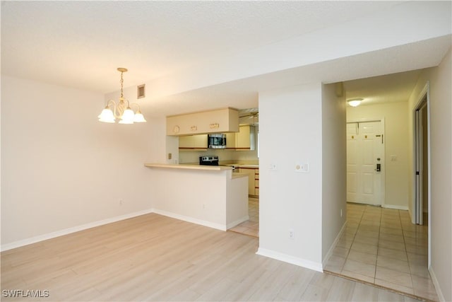 interior space featuring light hardwood / wood-style flooring and a chandelier