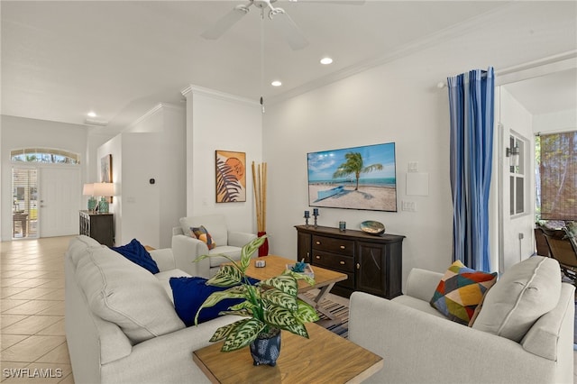 living room with ornamental molding, a healthy amount of sunlight, light tile patterned floors, and ceiling fan