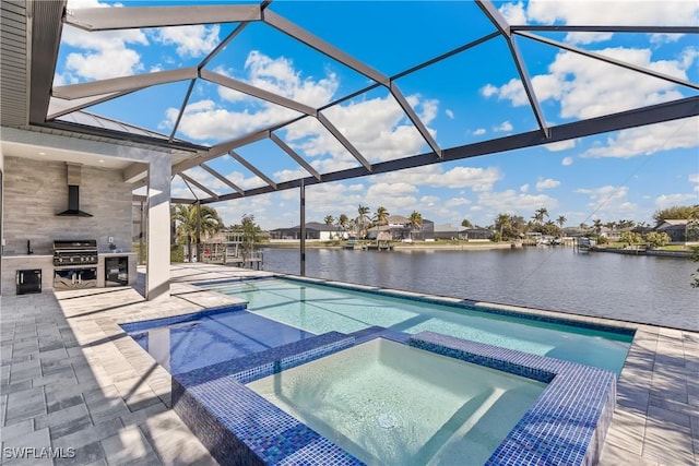 view of swimming pool with an in ground hot tub, area for grilling, a lanai, and a water view