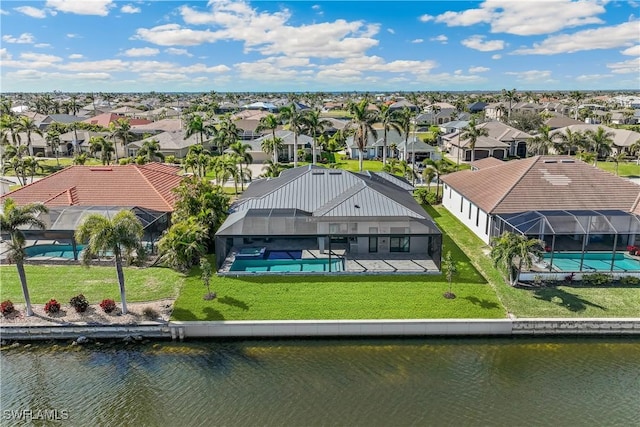 birds eye view of property with a water view