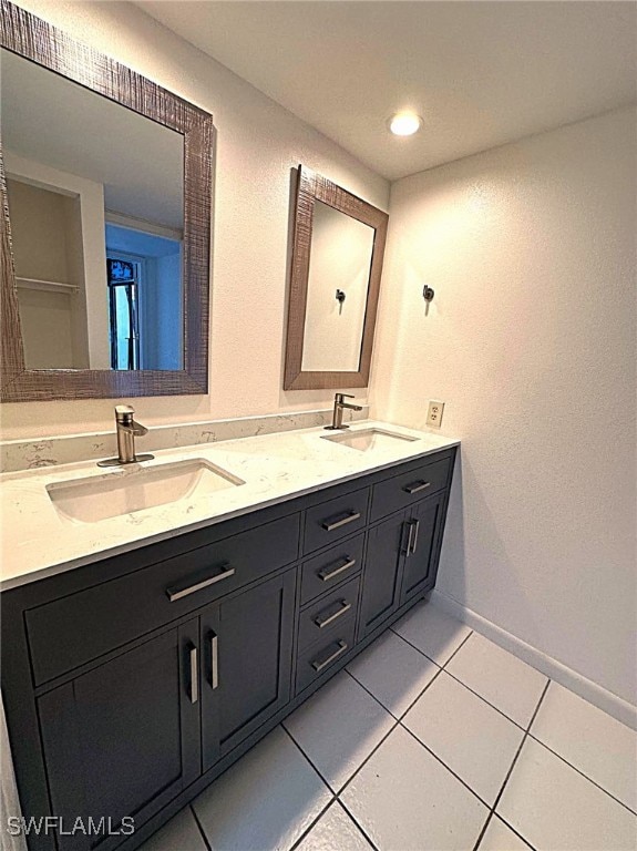 bathroom featuring tile patterned floors and vanity