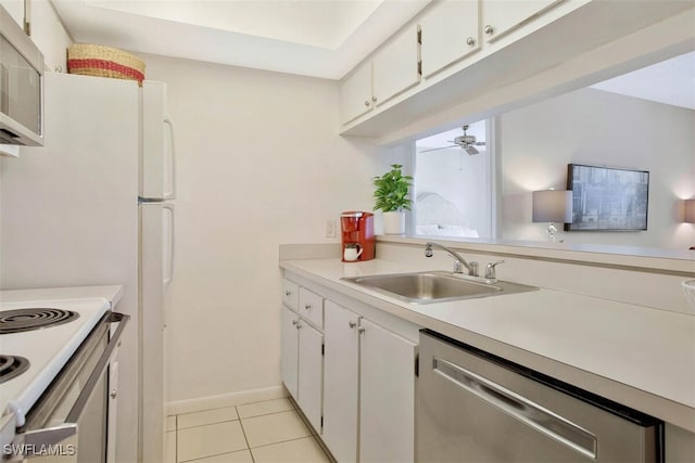 kitchen featuring sink, light tile patterned floors, ceiling fan, white cabinetry, and stainless steel appliances