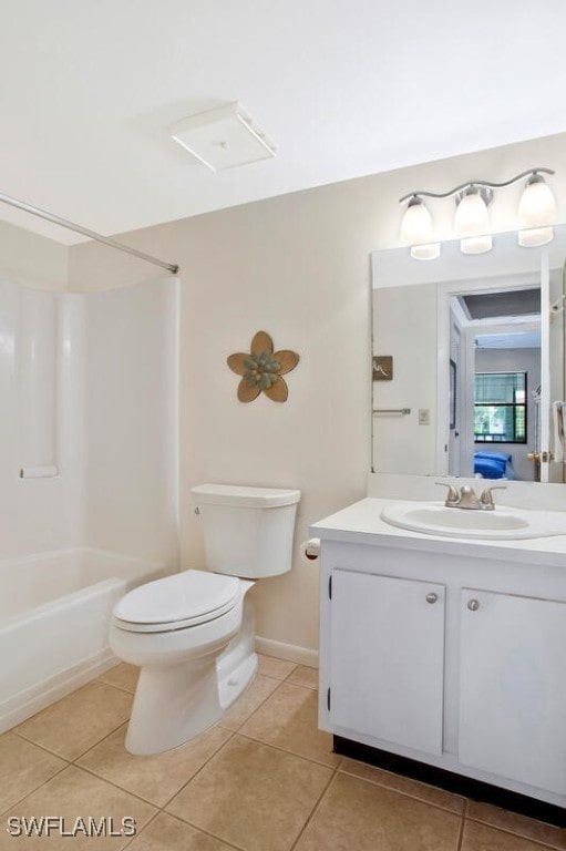 full bathroom featuring washtub / shower combination, tile patterned floors, toilet, and vanity