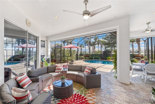 5683 Whispering Willow Way, Fort Myers, FL 33908 - view of patio / terrace featuring an outdoor hangout area, ceiling fan, an outdoor pool, and a lanai