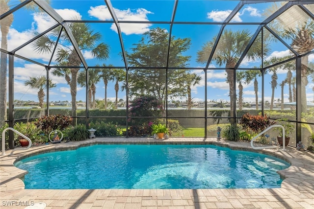 5683 Whispering Willow Way, Fort Myers, FL 33908 - swimming pool with a lanai and a patio