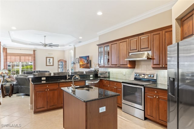 5683 Whispering Willow Way, Fort Myers, FL 33908 - kitchen with stainless steel appliances, under cabinet range hood, a peninsula, light tile patterned floors, and open floor plan