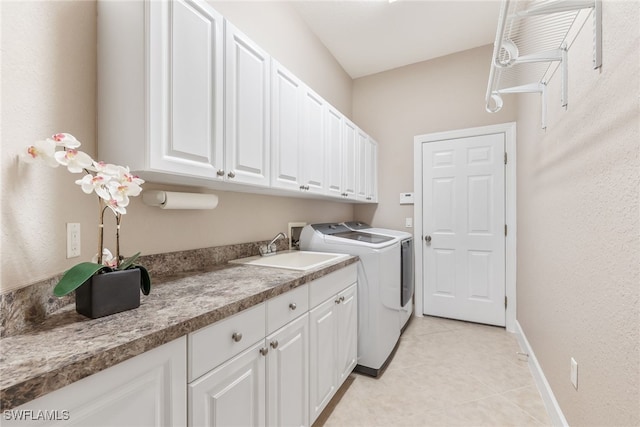 5683 Whispering Willow Way, Fort Myers, FL 33908 - washroom with washing machine and clothes dryer, cabinet space, and light tile patterned floors
