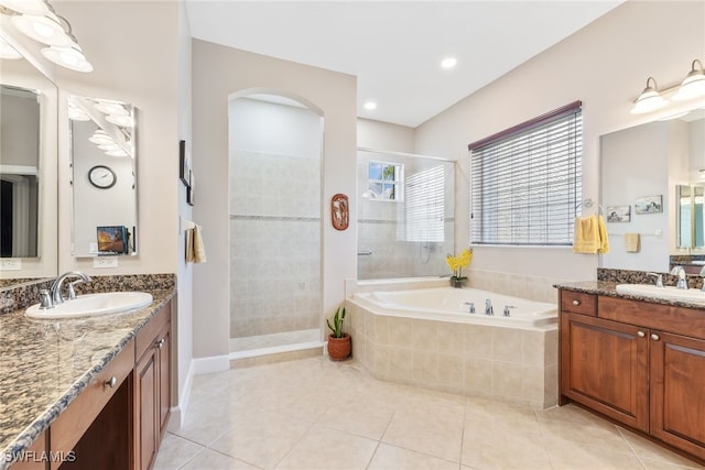 5683 Whispering Willow Way, Fort Myers, FL 33908 - full bath with a tile shower, a bath, two vanities, tile patterned flooring, and recessed lighting