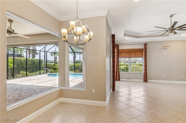 5683 Whispering Willow Way, Fort Myers, FL 33908 - empty room featuring a ceiling fan, ornamental molding, tile patterned flooring, and a chandelier