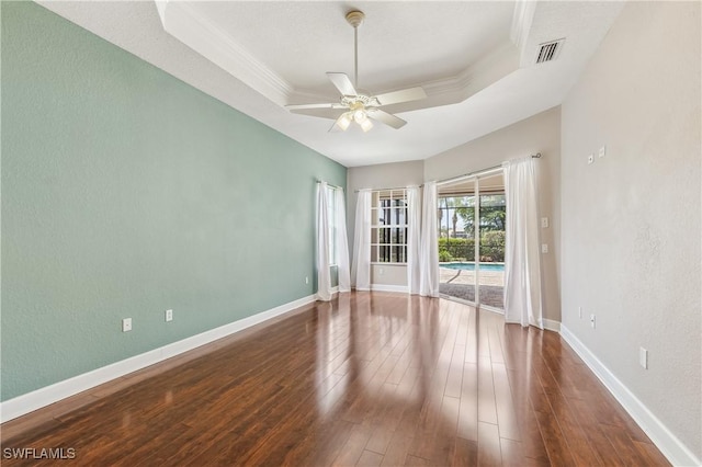 5683 Whispering Willow Way, Fort Myers, FL 33908 - unfurnished room with ceiling fan, a tray ceiling, hardwood / wood-style floors, and ornamental molding