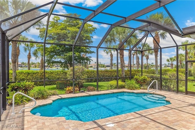 5683 Whispering Willow Way, Fort Myers, FL 33908 - outdoor pool with a patio area, glass enclosure, and a water view