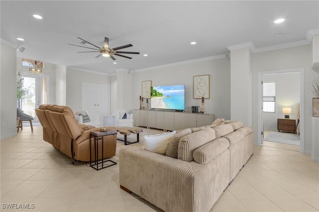 tiled living room featuring ornamental molding and ceiling fan