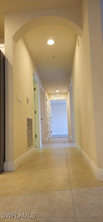 hallway with light tile patterned floors