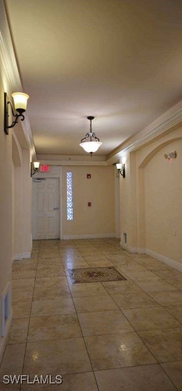 entryway featuring crown molding