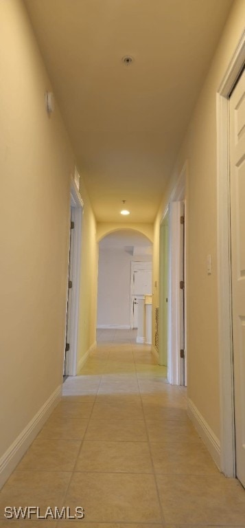 corridor featuring light tile patterned floors