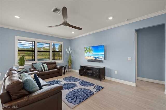 living room featuring crown molding, ceiling fan, and light wood-type flooring