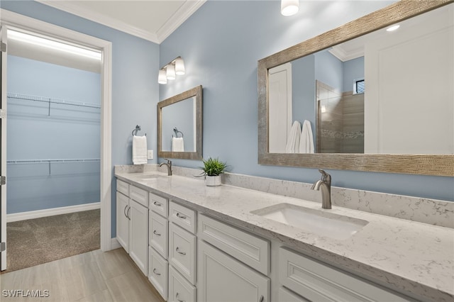 bathroom with vanity and ornamental molding