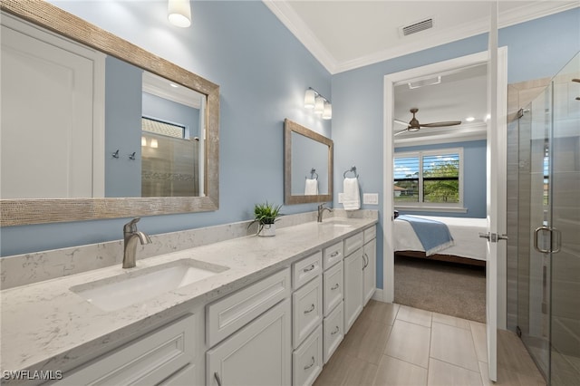 bathroom featuring vanity, an enclosed shower, tile patterned floors, and ornamental molding