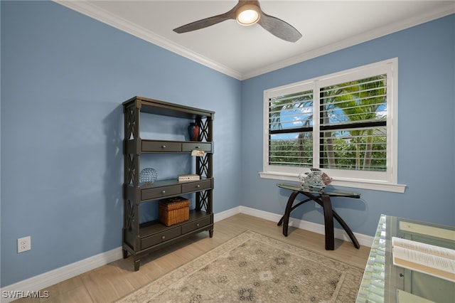 office space featuring ceiling fan, ornamental molding, and light hardwood / wood-style flooring