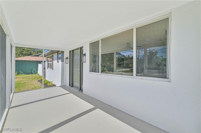 view of patio featuring ceiling fan