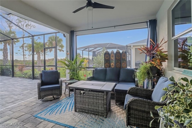 sunroom with ceiling fan