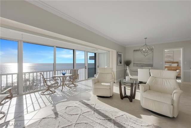 interior space featuring an inviting chandelier, ornamental molding, light tile patterned flooring, and a water view