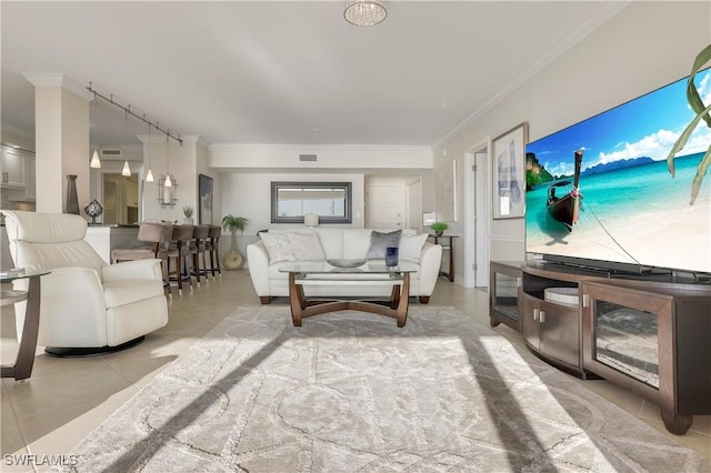 living room with light tile patterned floors and crown molding