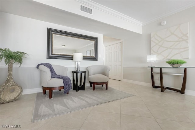 living area with crown molding and light tile patterned floors