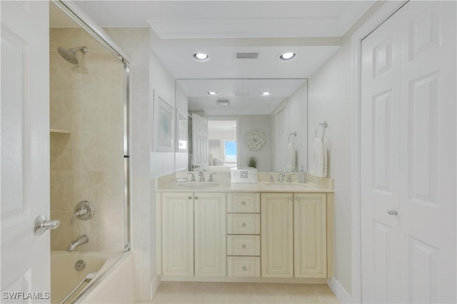 bathroom with enclosed tub / shower combo and vanity