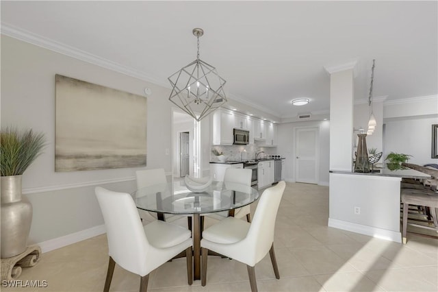 tiled dining room featuring ornamental molding and a chandelier