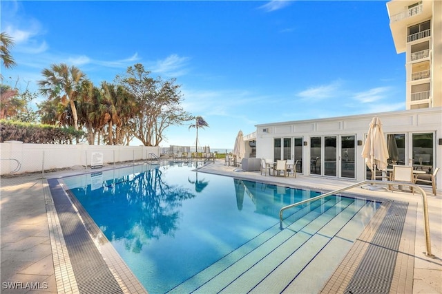 view of swimming pool with a patio area