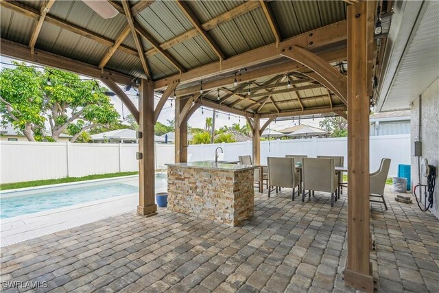 view of patio featuring a gazebo and an outdoor wet bar