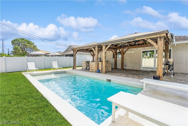 view of swimming pool featuring a fenced in pool, a yard, a patio, a gazebo, and a fenced backyard