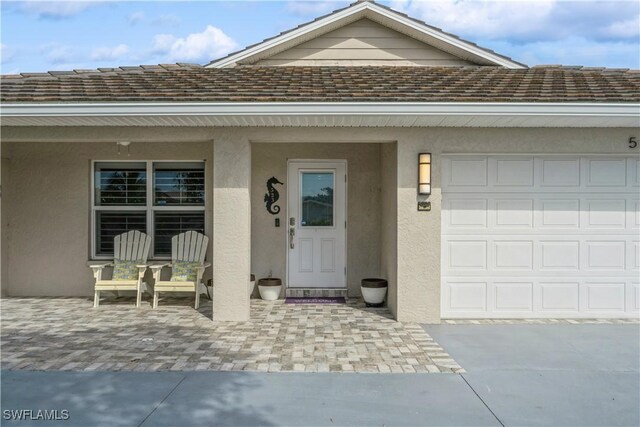 entrance to property featuring a garage