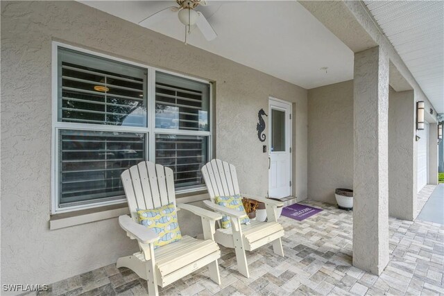 view of patio featuring ceiling fan