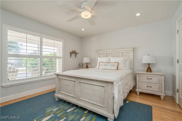 bedroom featuring light hardwood / wood-style floors and ceiling fan