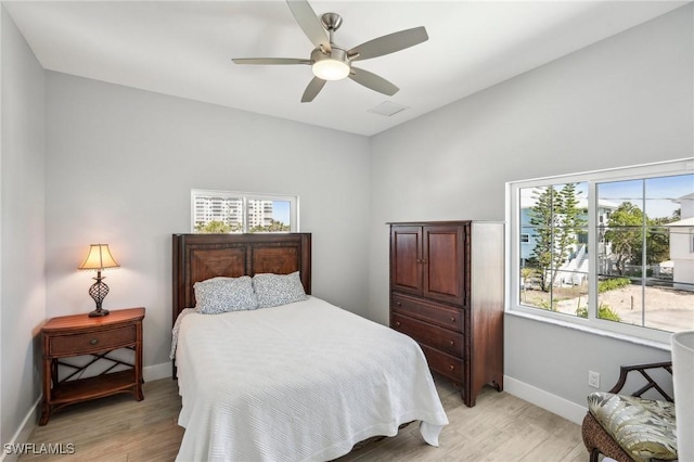 bedroom featuring ceiling fan and light wood-type flooring