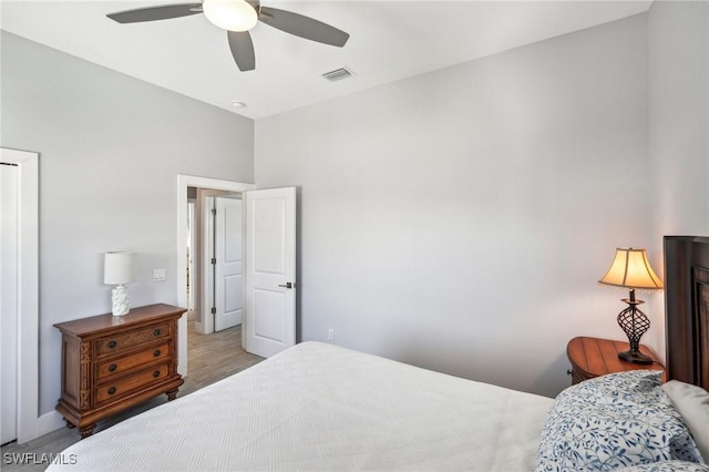 bedroom with ceiling fan and light hardwood / wood-style flooring