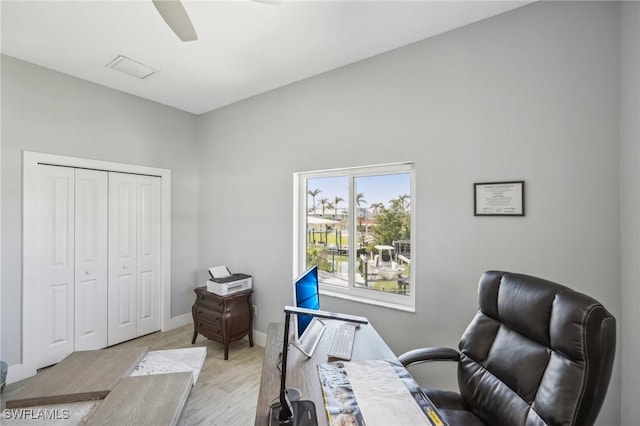 office space with ceiling fan and light wood-type flooring