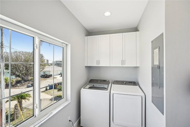 laundry room featuring cabinets and separate washer and dryer