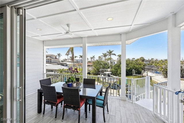 sunroom with coffered ceiling and ceiling fan