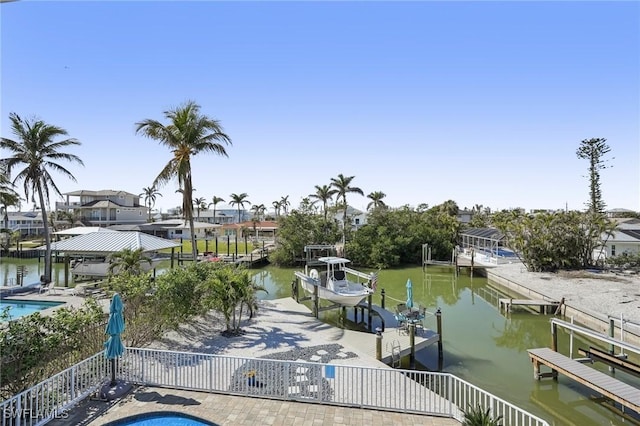 dock area featuring a water view, a community pool, and a patio