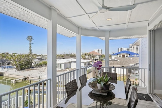 sunroom with coffered ceiling and ceiling fan